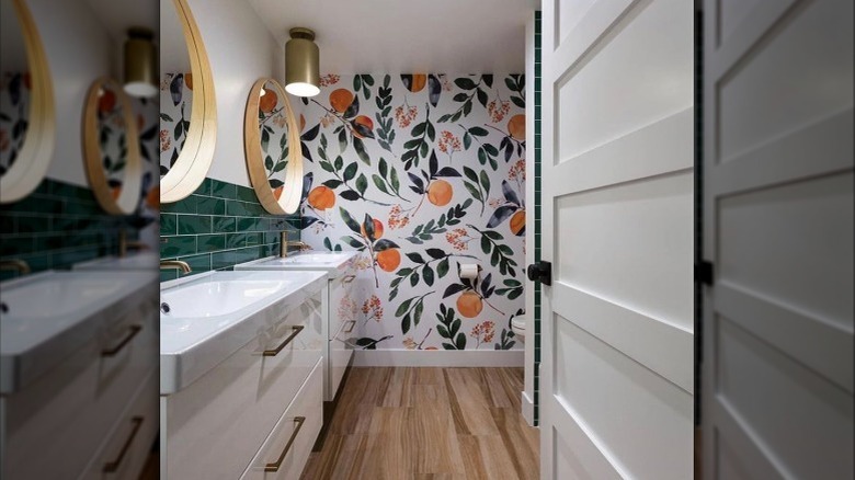 white bathroom with orange wallpaper