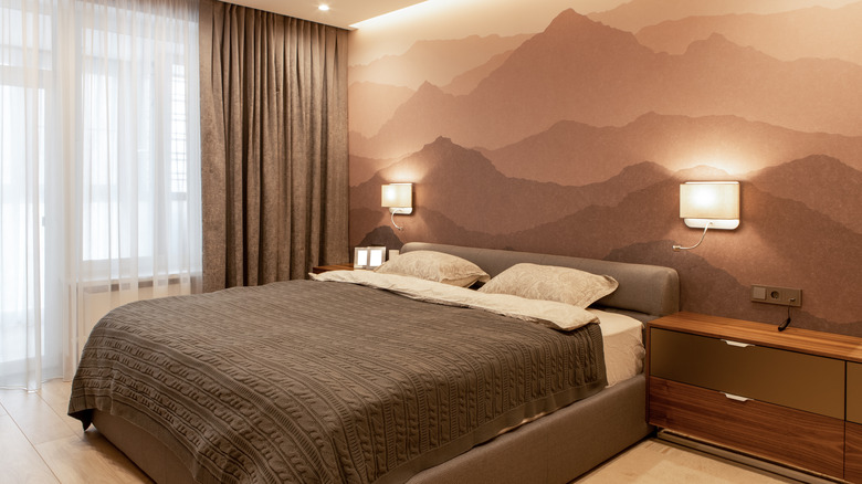 mountain mural behind bed