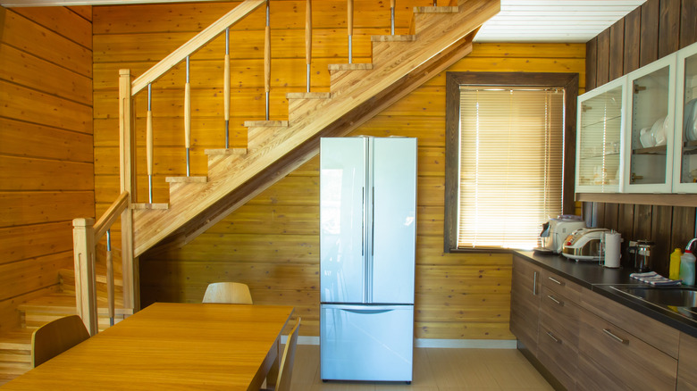 kitchen under wooden staircase