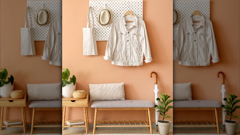 pegboard above bench in entryway