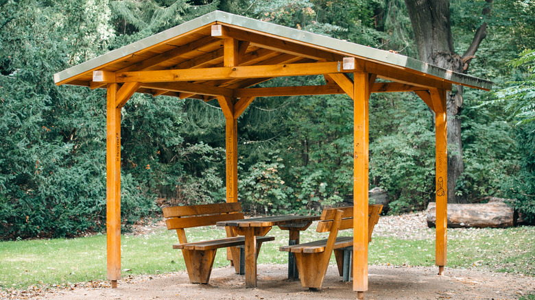 wooden gazebo with benches