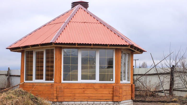 wooden gazebo with windows