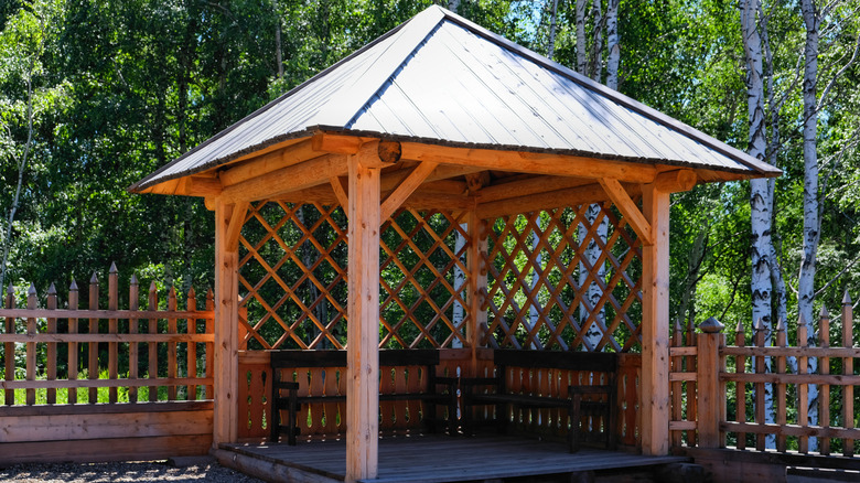 wooden gazebo with lattice details