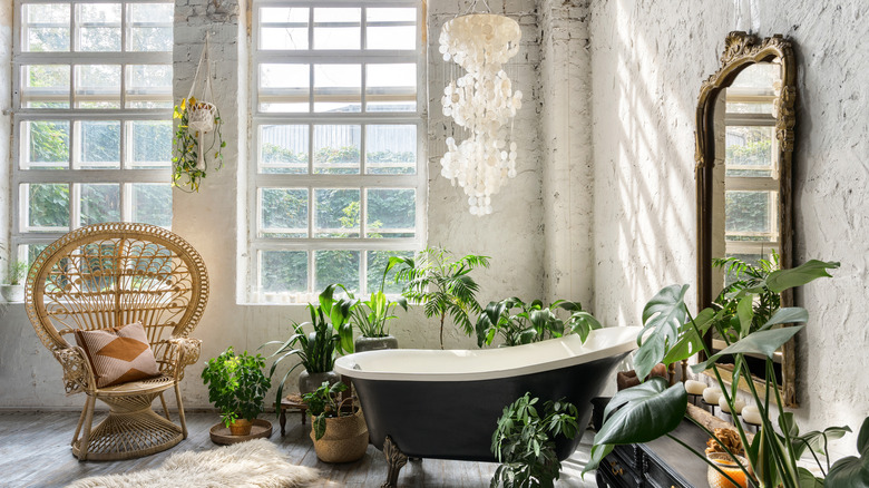 bathroom with plants and mirrors