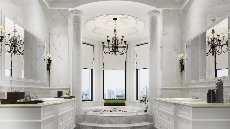 chandelier in large, white bathroom