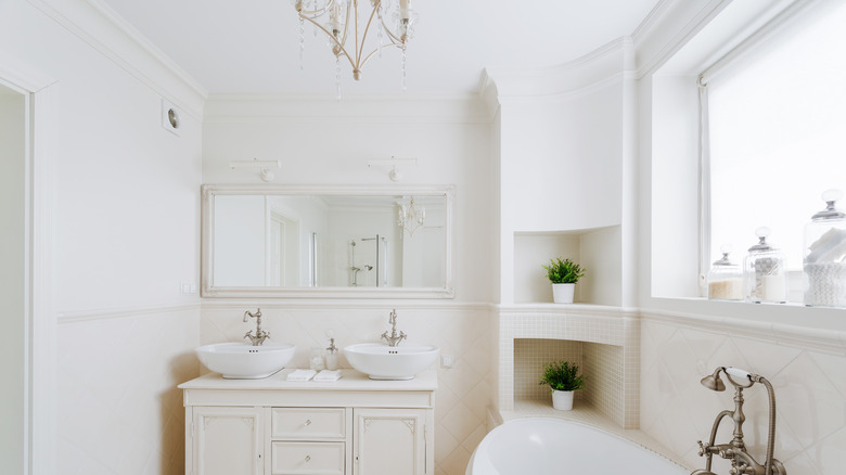 french country bathroom with chandelier 