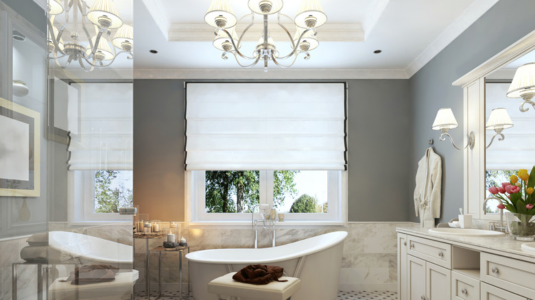 white bathroom with chandelier 