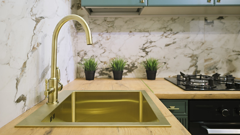 Gold sink in kitchen