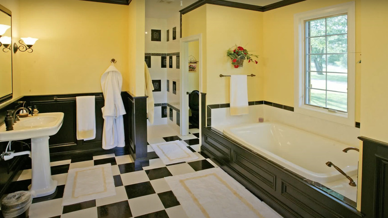 Yellow bathroom with checkered floor