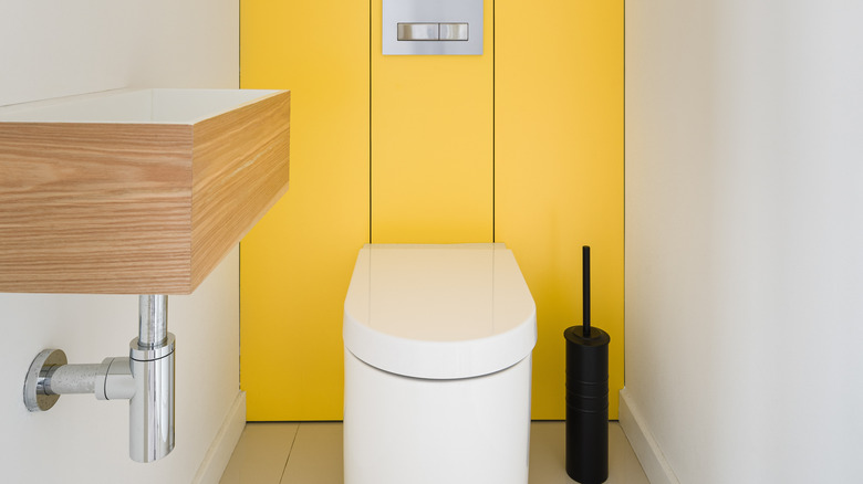 Bathroom with yellow focal point wall