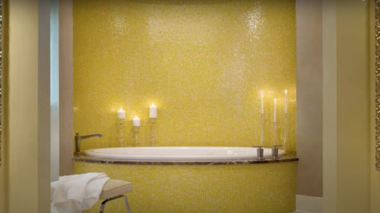 Yellow mosaic tile on bathtub