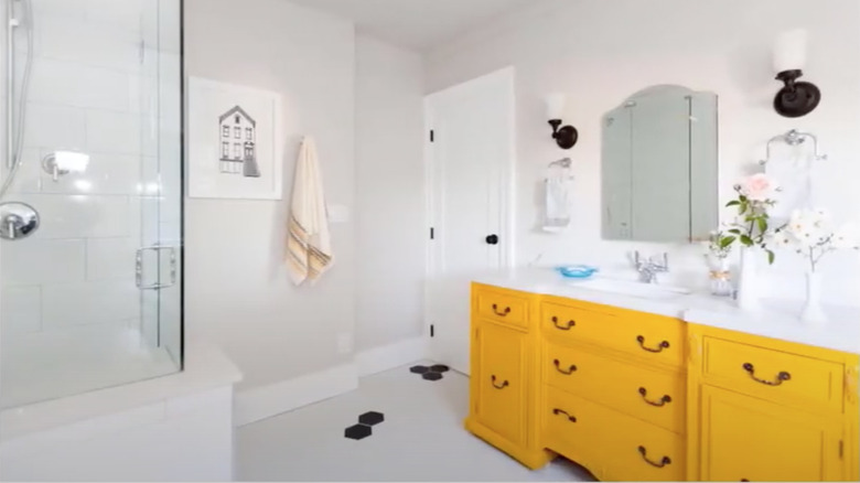 Yellow cabinet in bathroom