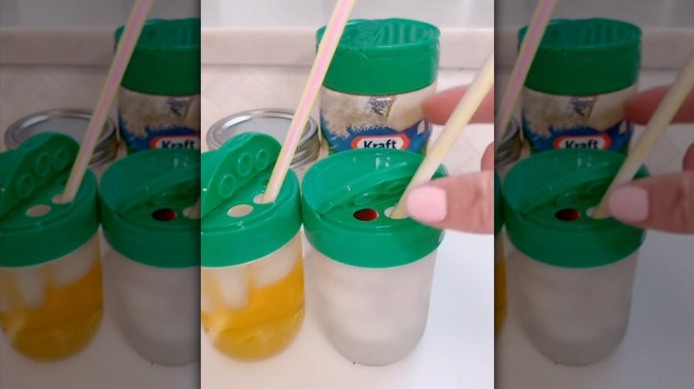 Add a parmesan cheese container lid to a mason jar and insert a straw to make a spill-proof cup.