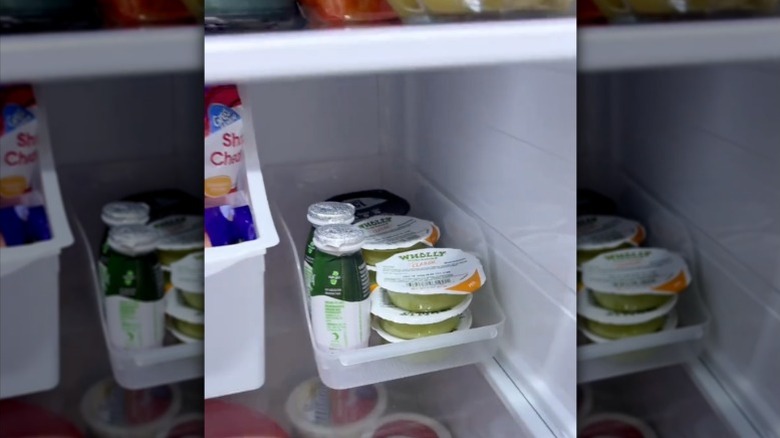 A can holder repurposed to store odd and small items in the fridge.