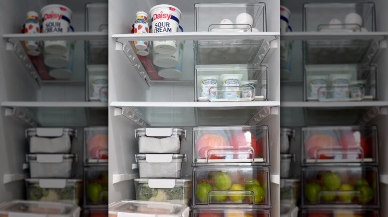 Using stackable desktop organizer drawers for fridge shelf storage.