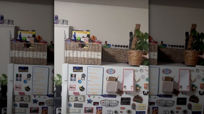 Dollar Tree baskets and cereal containers adorn the top of a fridge to add more storage options.