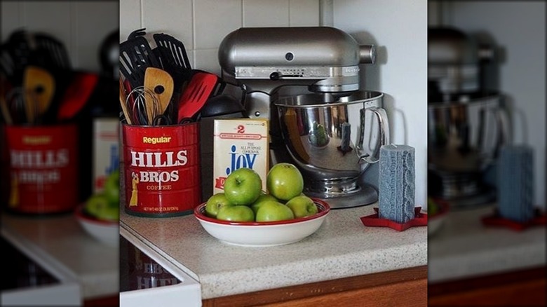 coffee can with kitchen utensils