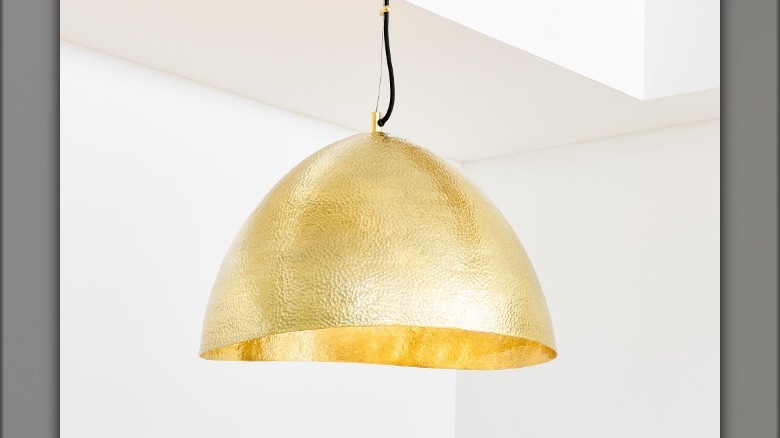 Oversized brass pendant light