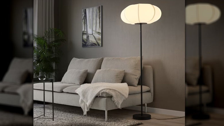 black floor lamp next to sofa