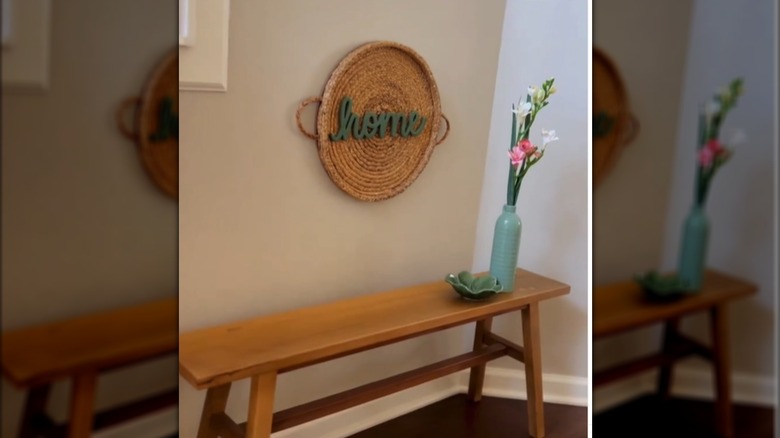 A cozy entryway with wooden bench and DIY decor