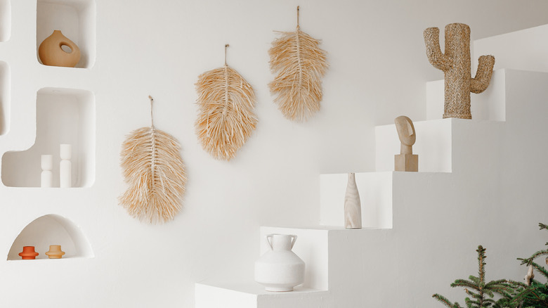 A white stair-like decor display near entryway