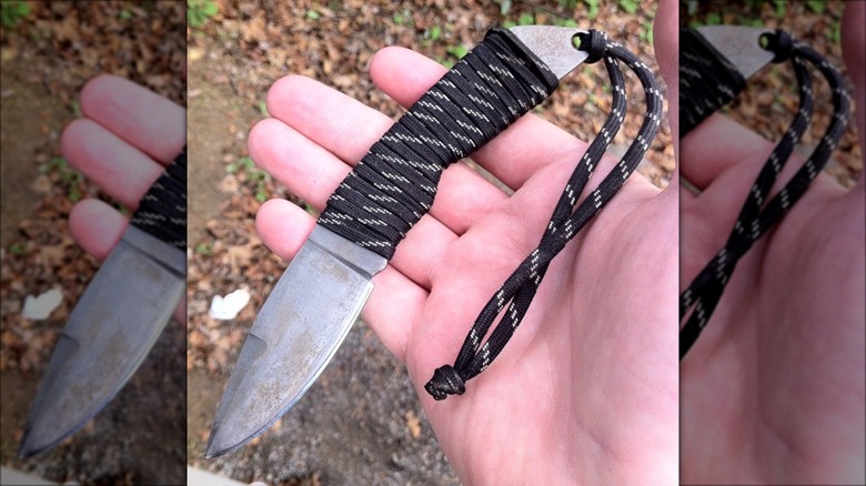 knife with shoelace around handle