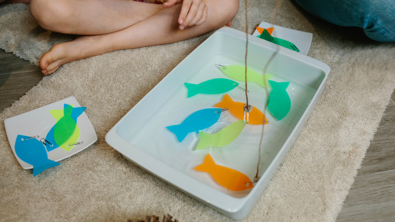 children playing homemade fishing game