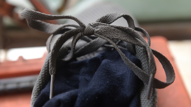 gray shoelaces on old shoe