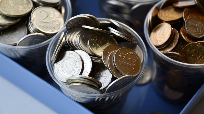 coins in plastic cups