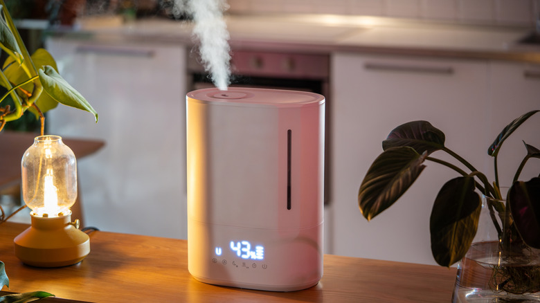 Ultrasonic air humidifier on wooden table