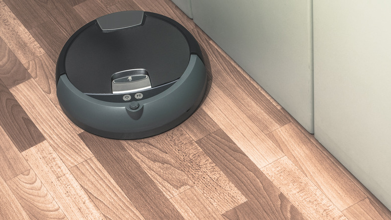 Robot cleaner on wood floor in home