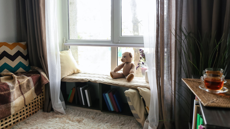 Library window nook with teddy bear