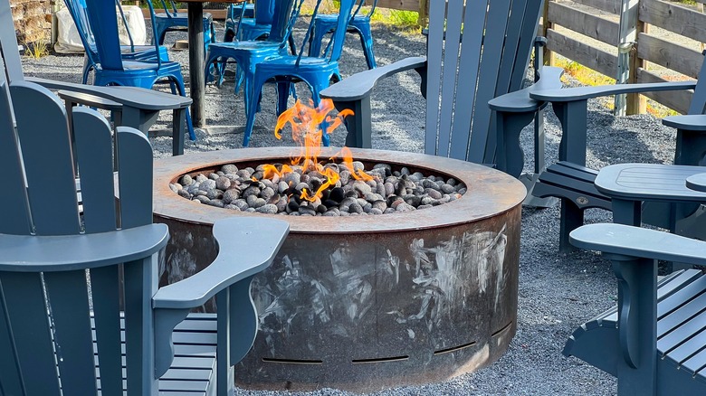 metal fire pit with stones