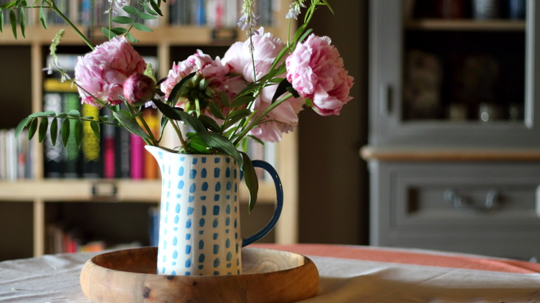 pink flowers in pitcher