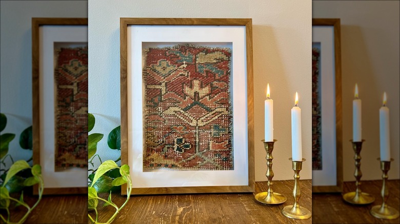 framed antique woven rug fragment