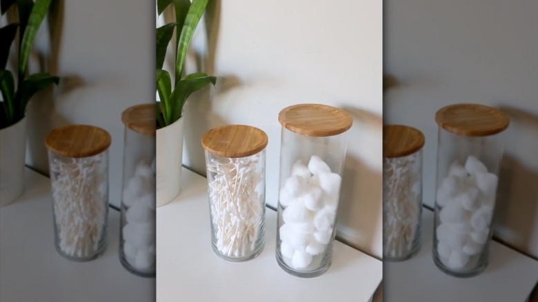 Filled glass jars topped with wooden coasters