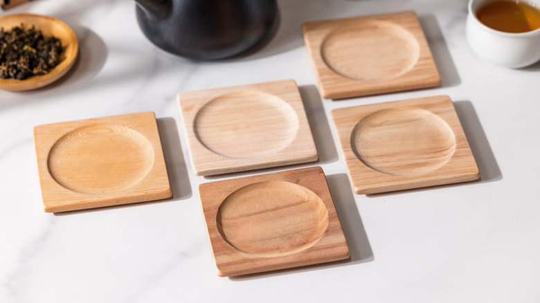 Several wooden coasters on a table