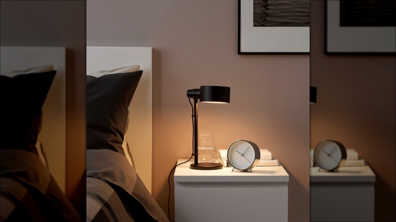 black work lamp on nightstand