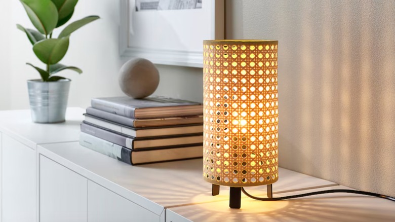 rattan table lamp on cabinet