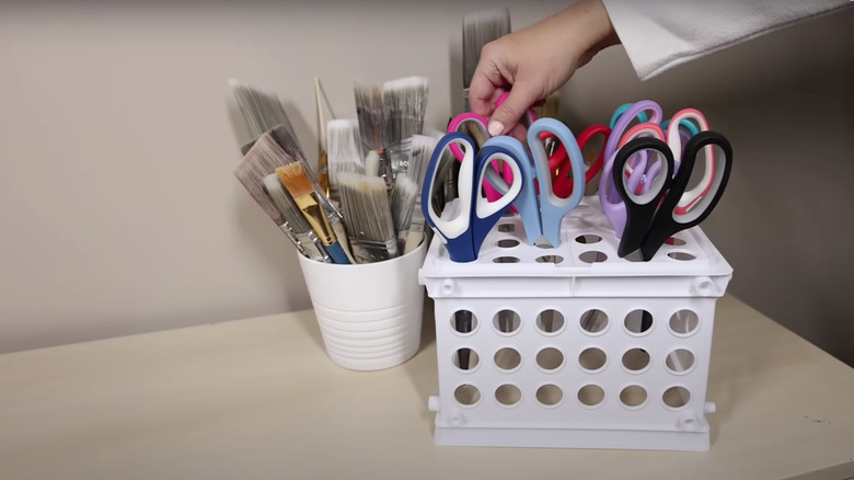 Scissors in plastic bin