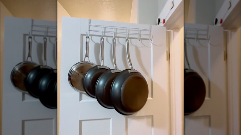 pans hanging on door