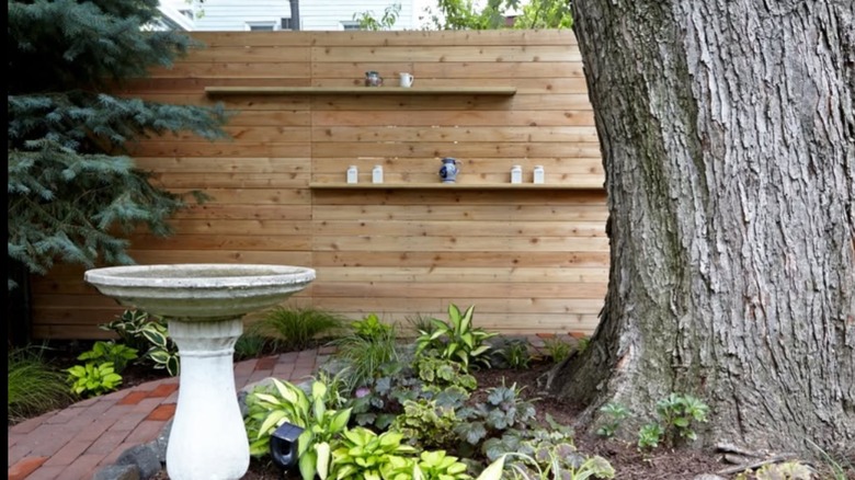 Wood fence with long floating shelves