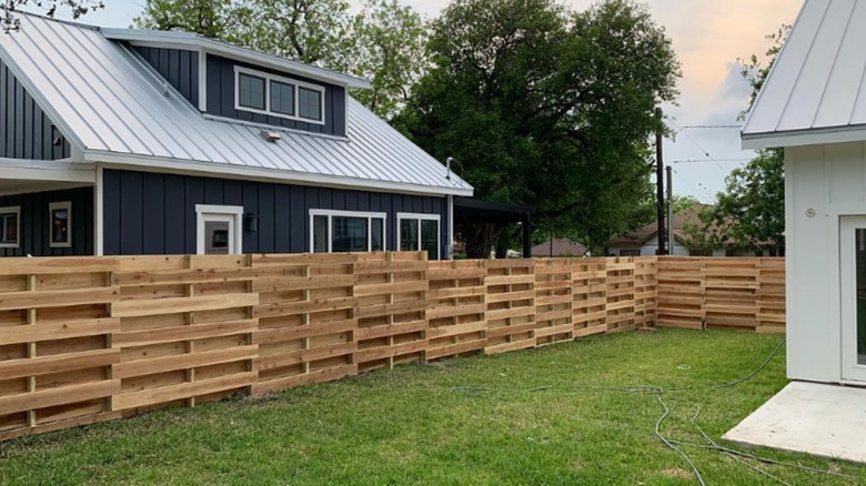 shipping pallet fence around yard