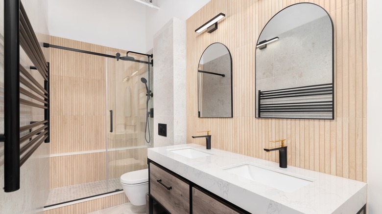 bathroom with wooden accent wall