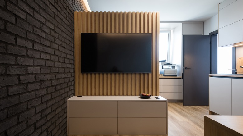 vertical wooden TV accent wall