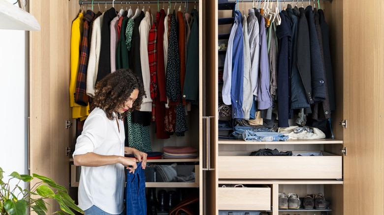 Woman organizing her closet