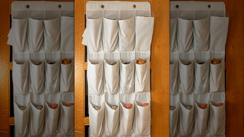 Footwear in various pockets of an over-the-door organizer