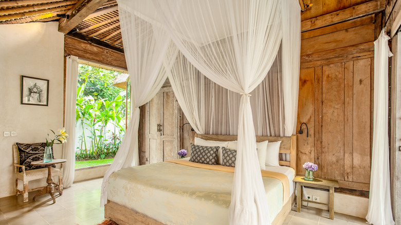 Bali bedroom with airy curtain