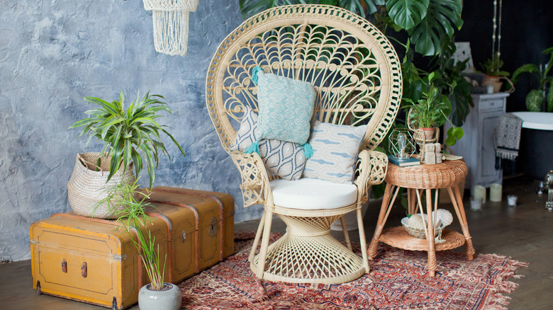 Large rattan chair with plants