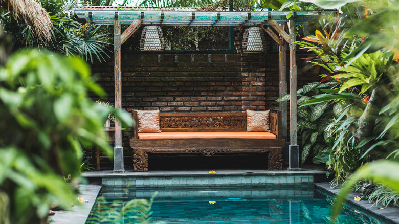 Hidden poolside bench with canopy